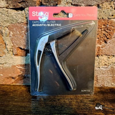 Stagg Curved Trigger Capo - Beige for sale