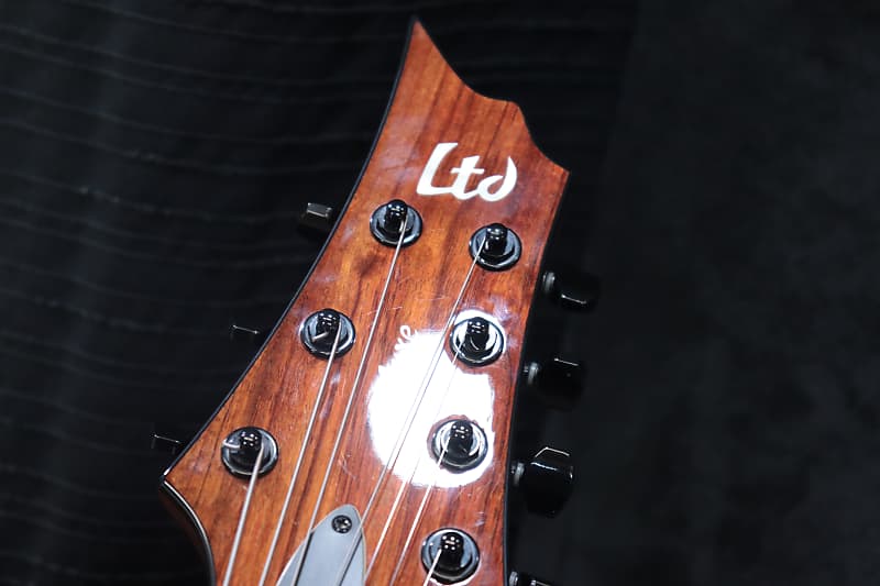 ESP LTD H-1007B Koa Neck-Thru-Body Baritone Electric Guitar ESP LTD H-1007B Koa Neck-Thru-Body Baritone Electric Guitar