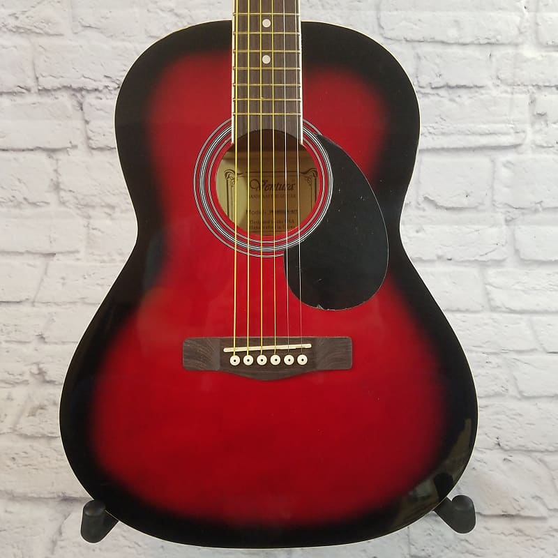 Red and deals black acoustic guitar