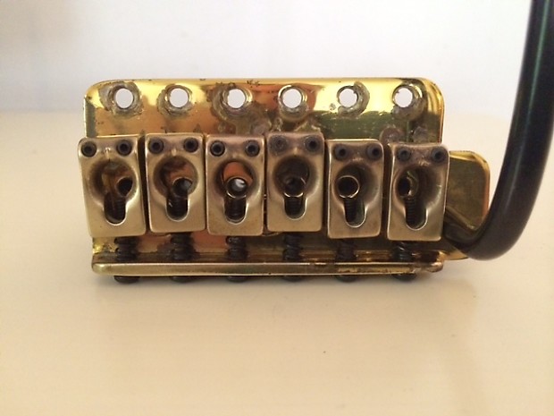Brass strat bridge outlet