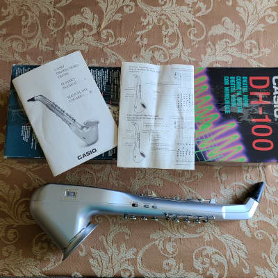 Casio DH-100 Digital Horn is a wind controller with DIN Midi and speaker