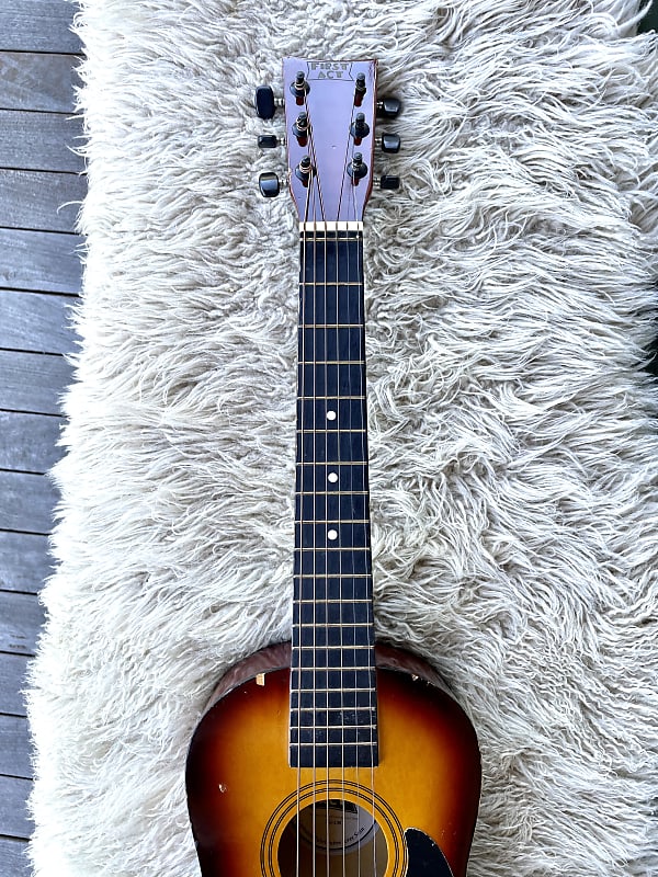 First act deals student acoustic guitar