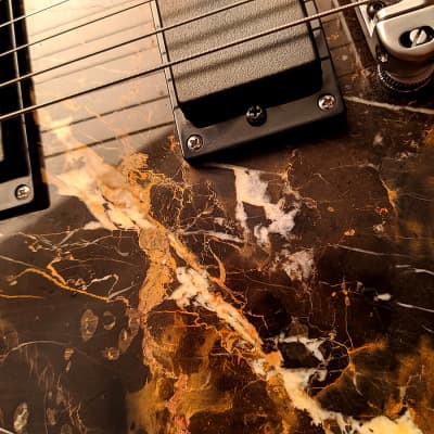 Guitarporn - This is insane! Zerberus Nemesis model with a top made of 0.2" real Black&Gold Marble image 12