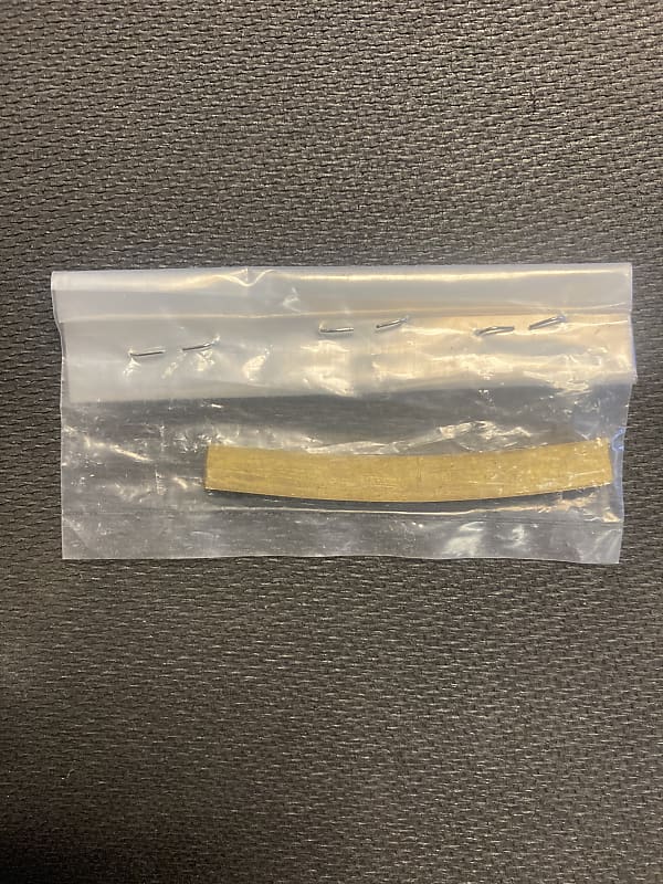 Allparts Curved Bottom Brass Bass Nut Blank Reverb