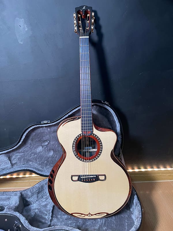 Merida Sadhu cutaway solid Spruce/ rosewood Acoustic guitar with hardcase
