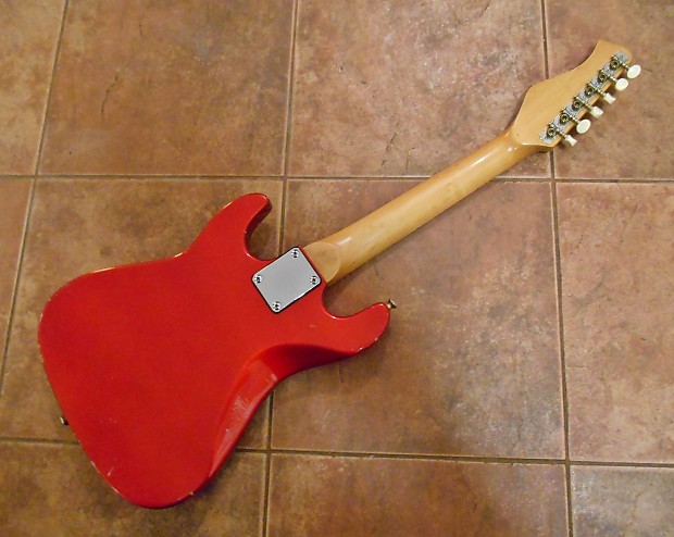 Vintage Harmony Mini Electric Guitar. Strat. Candy Apple Red Metallic. Relic