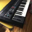 Akai AX80 Synthesizer 8 voice polyphonic analog. Better than a Juno. Includes original soft case.