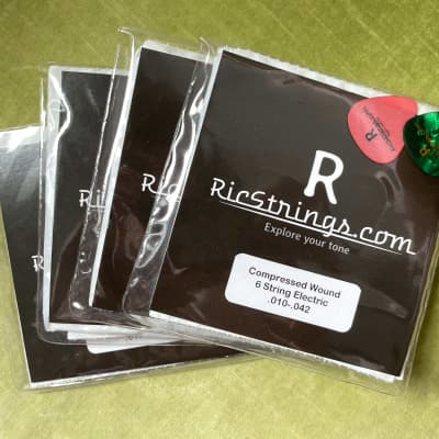4 packs of RicStrings - Compression Wound Rickenbacker Strings (with 2 bonus D'addario halfwound) image 1