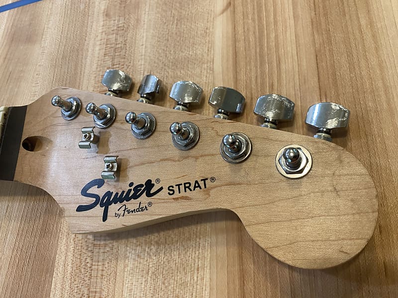Squier by Fender Stratocaster with tuners and neck plate and screws