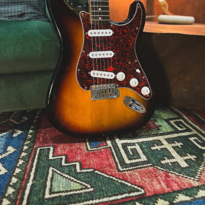 2006 Squier Stratocaster Electric Guitar in 3-Tone Sunburst (with Modified Scratchplate and Backplate) image 1