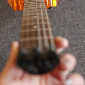 Headless 6 string guitar, Orange Lucite, Overlord of Music Headless 6 string guitar, Orange Lucite, Overlord of Music
