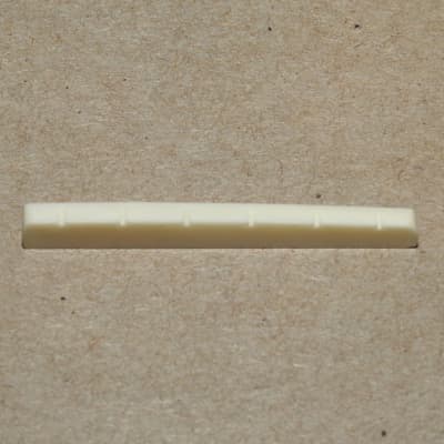 Allparts BN-0251-000 Bleached And Slotted Flat Bottom Nut for Fender Style Guitars 1 11/16" Long image 1