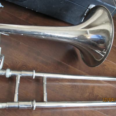 Trigger trombone with case and mouthpiece.  Silver image 6