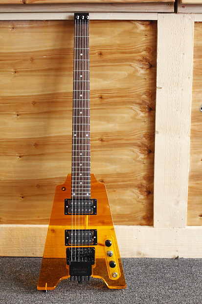 Headless 6 string guitar, Orange Lucite, Overlord of Music Headless 6 string guitar, Orange Lucite, Overlord of Music