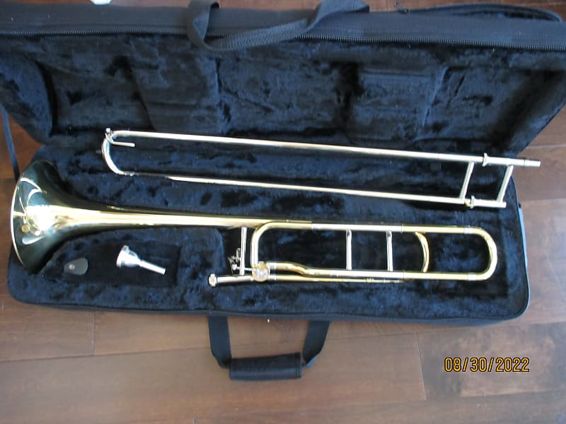 Gold trigger trombone with case and mouthpiece, Open wrap. Reverb