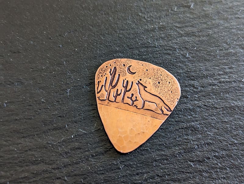 copper guitar pick hammered and with howling coyote Reverb