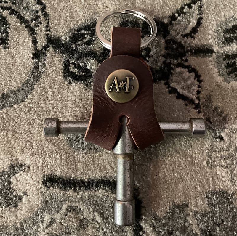 A&F Drum Co, LLC  Drum Key Nickel with Leather Holster image 1