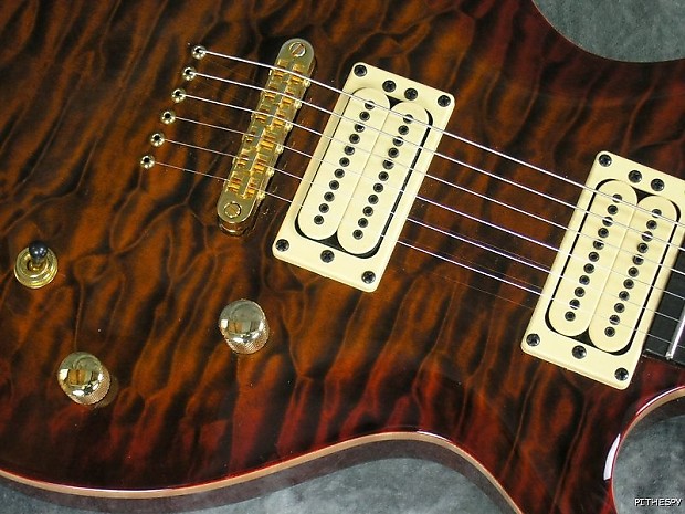 Through body store guitar bridge