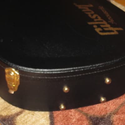 lightly used genuine Gibson Dreadnought Hardshell Case from 2017 - Black Tolex Exterior, Wood Construction, Black Plush Padded Interior, Gold Colored Hardware, lid has Gibson Acoustic Logo, fits square or round shoulder dreadnought (NO guitar included) image 12