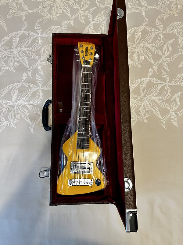 Chiquita (Marty McFly’s guitar from Back to the Future) Travel Guitar 1980  - present - Yellow gloss