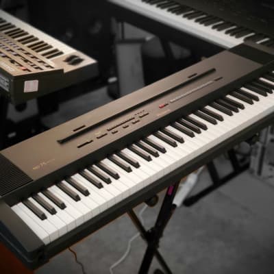 SEMI-WEIGHTED-76-KEY ROLAND EP75 DIGITAL PIANO FULLY FUNCTIONAL IN AMAZING CONDITION!