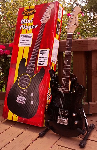 Mini guitar built in cheap speaker