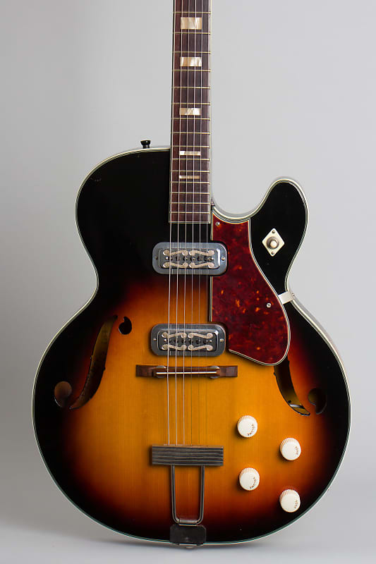 Harmony Meteor H-70 Arch Top Hollow Body Electric Guitar (1963), ser.  #1311H70, original blond two-tone chipboard case.