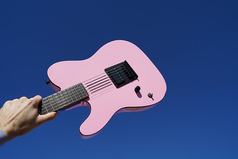 Pink left deals handed electric guitar