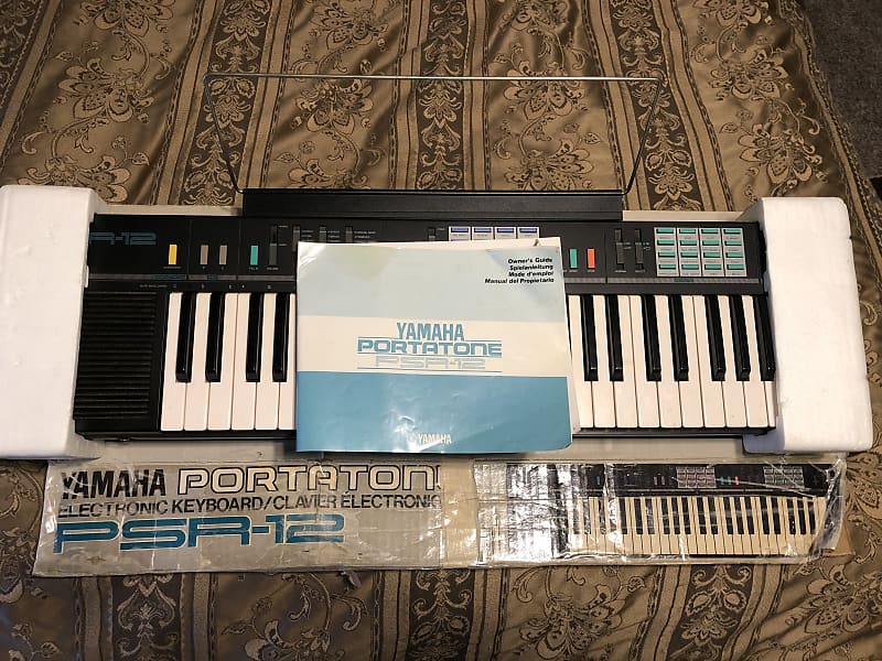 Yamaha PSR-12 with original box, music stand and manual. image 1