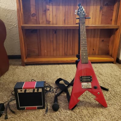 First Act ME273 Red Arrow Mini Flying V Electric Guitar w Amp BONUS Mic Stand and Strap Reverb France