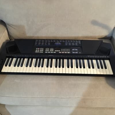 Kawai X65-D electric keyboard (1990s), with cover