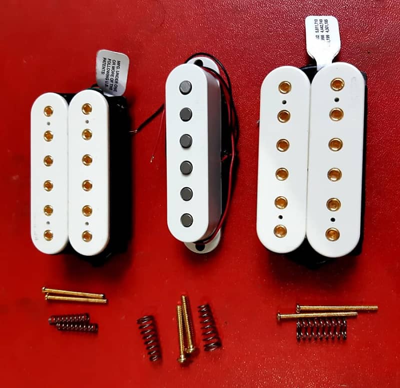 DiMarzio Evolution pickups set in white with gold pole pieces