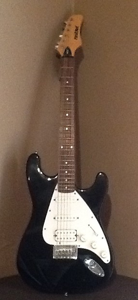 First act electric guitar black and white hotsell