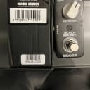Mooer Black Secret distortion pedal with 4 packs of D’Addario XS 10-46 electric guitar strings