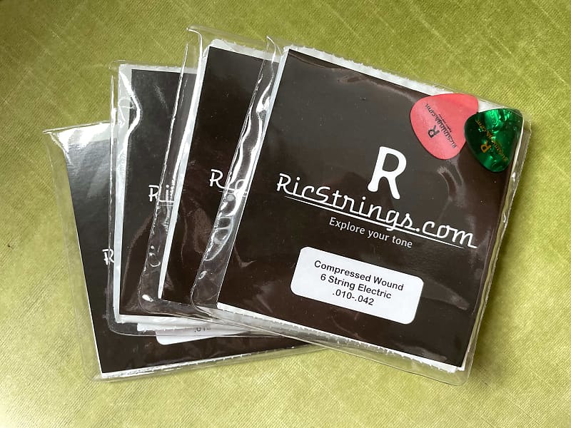 4 packs of RicStrings - Compression Wound Rickenbacker Strings (with 2 bonus D'addario halfwound) image 1