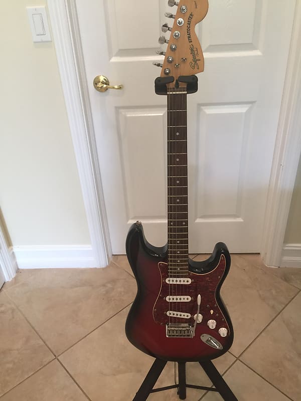 Fender Squier  by Fender Stratocaster Standard Series Rare  Black and Red image 1
