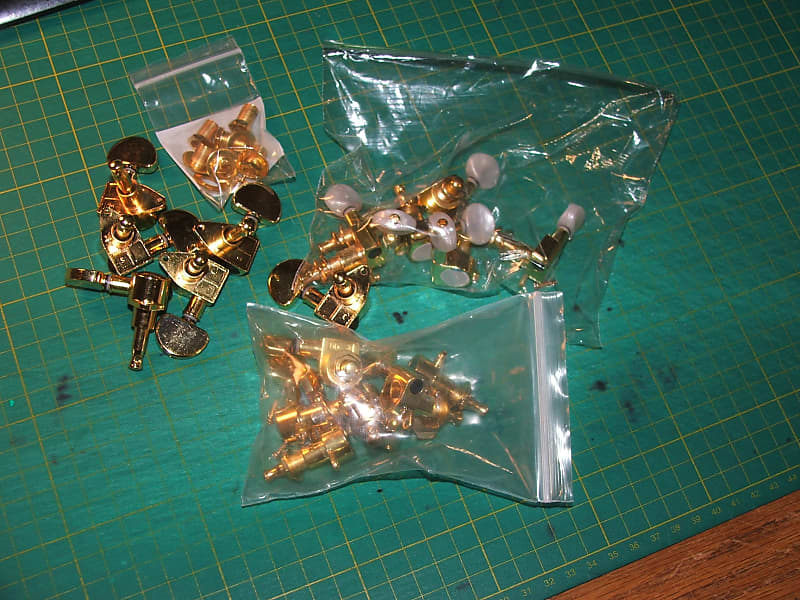 lot of (18)  gold tuners(2) 3x3  with screws & all hardware needed...(1) 6 in line w/pearloid button image 1