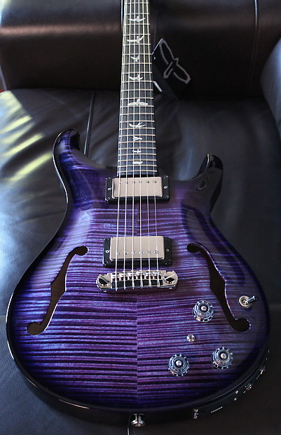 Purple hollow outlet body guitar