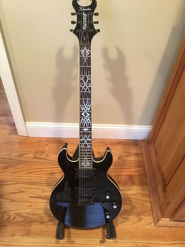 Schecter S1 Devil Diamond series with tribal inlays and soft