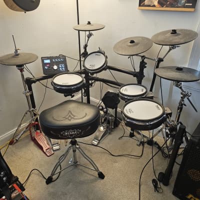 Roland TD-25KV V-Drum Kit t with additional cymbal, double bass pedal, hi-hat stand, and throne