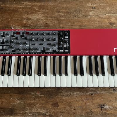 Nord Wave 49-Key 18-Voice Polyphonic Synthesizer 2007 - 2013 - Red. One button has been changed for a new. It is slightly smaller, but otherwise it is in a very good condition