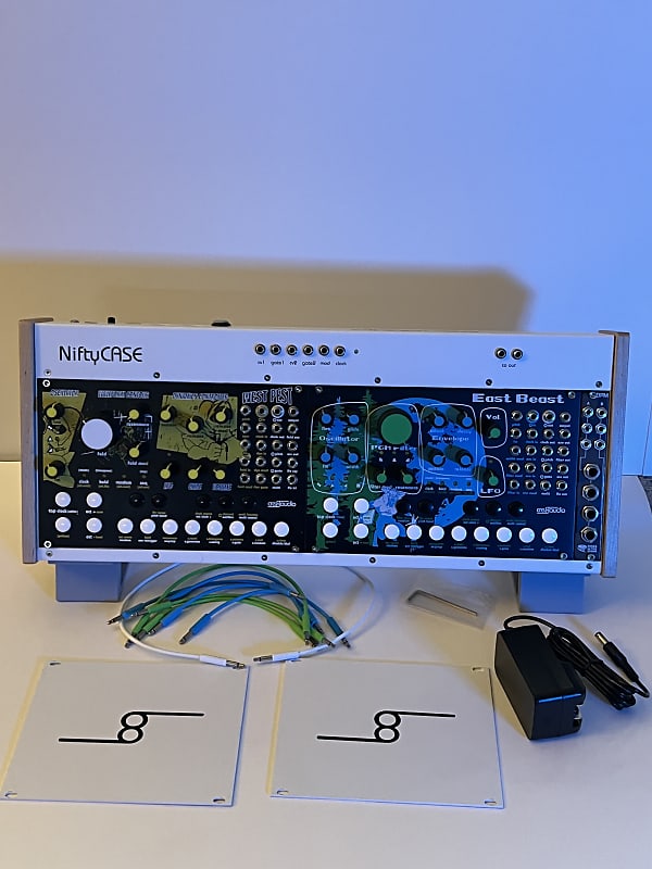 A Niftycase w/ East Beast, West Pest, Ride the Storms DPM a pair of stands  and some cables.